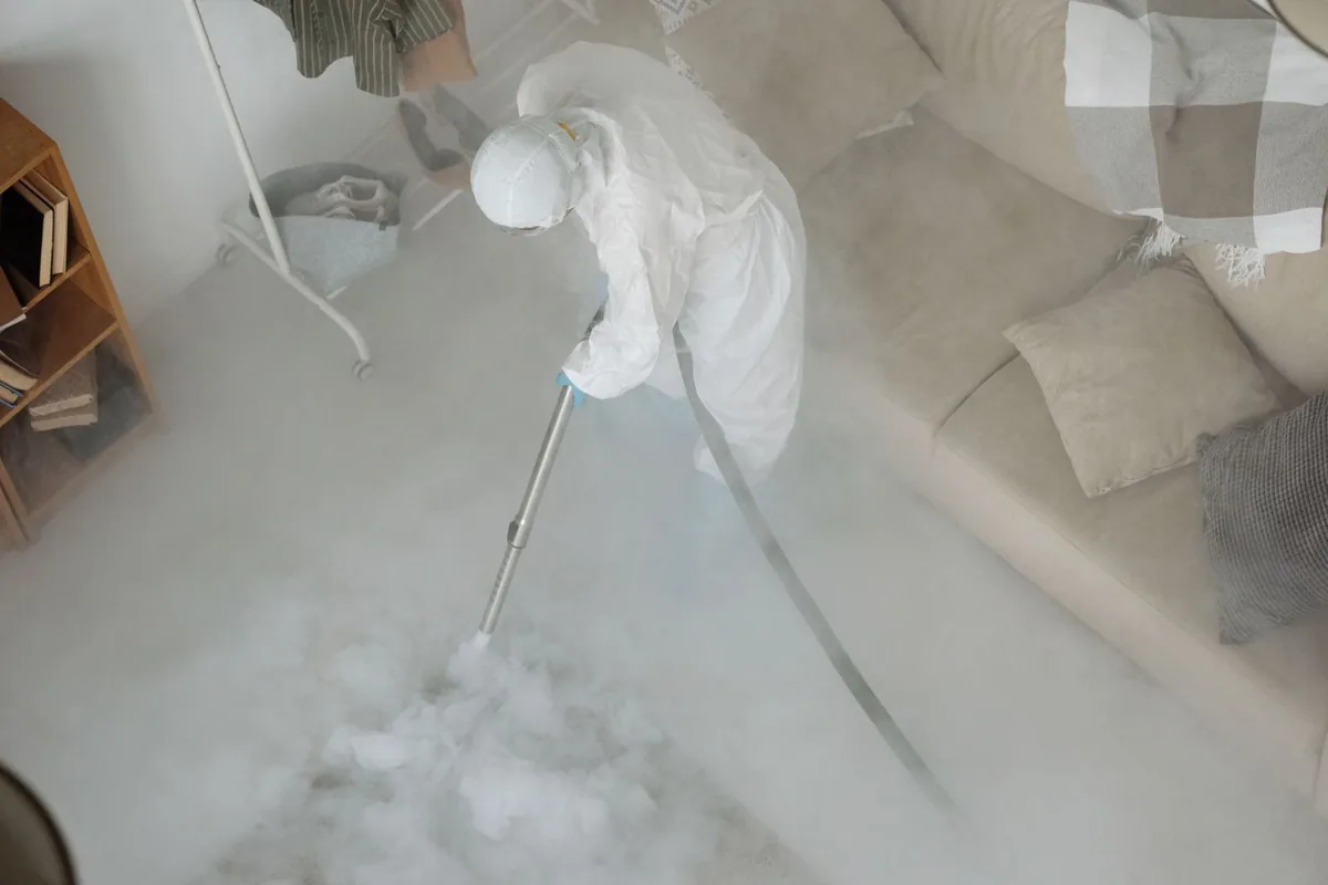 Biohazard cleanup technician in protective equipment, Sterling Acres, Kansas City, MO